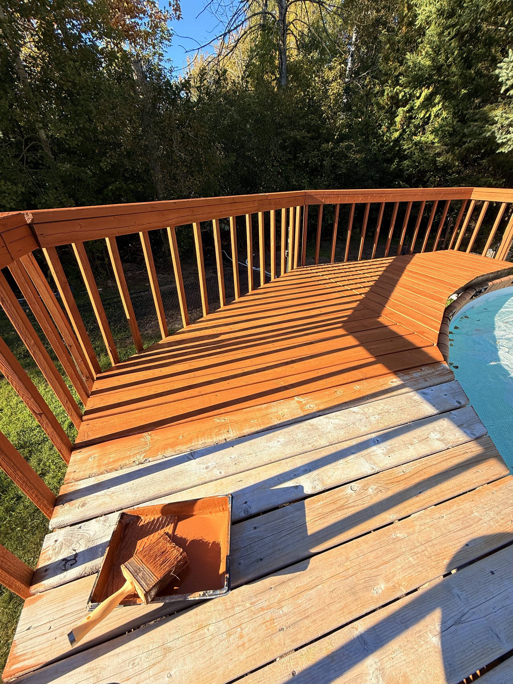 Before: Pool-side deck mid-stain, tray and reddish-brown stain in progress