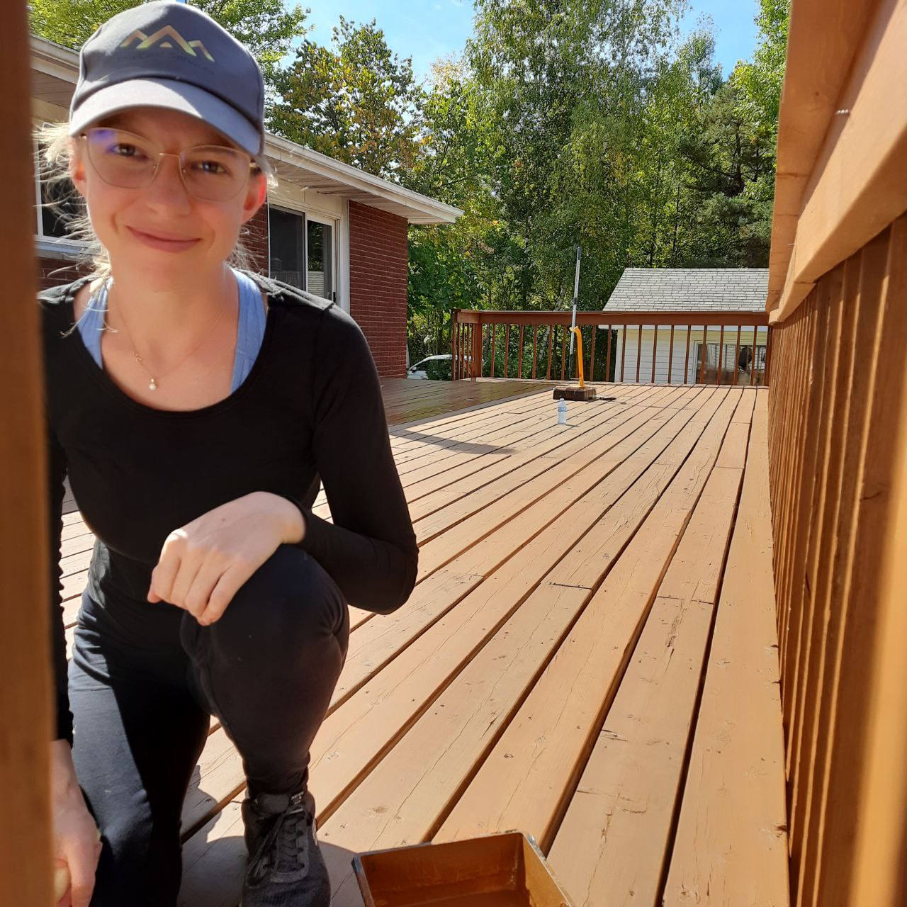 TrueCoat team member on a freshly stained deck